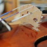 change violin strings leaning forward