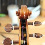 change violin strings by fitting the string on the right side